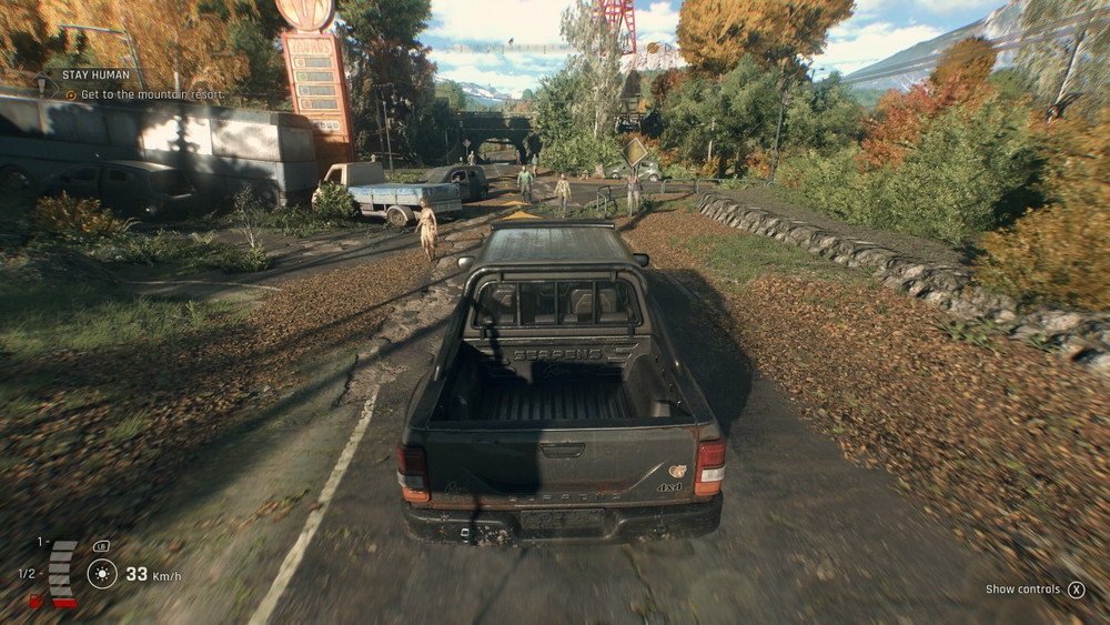 Gameplay clip showing driving a pickup truck in the countryside