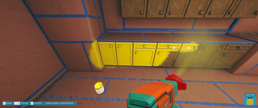 A view of that same kitchen being painted yellow
